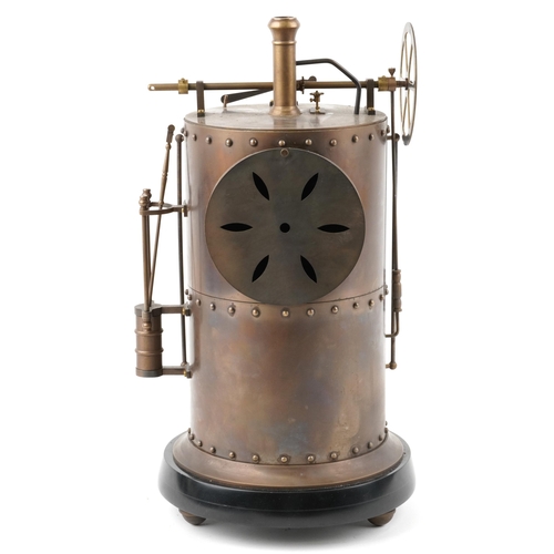 1064 - A large French brass clock in the form of an industrial boiler, striking on a bell, having enamelled... 