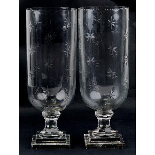 1063 - A pair of Regency style etched glass celery vases, the largest 40.5cm high.