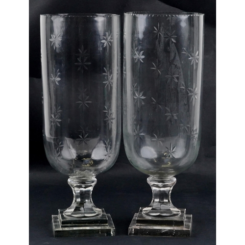 1063 - A pair of Regency style etched glass celery vases, the largest 40.5cm high.