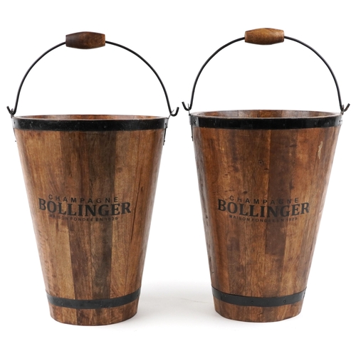 1029 - A pair of Bollinger Champagne hardwood ice buckets with metal mounts and swing handles, H-40cm.