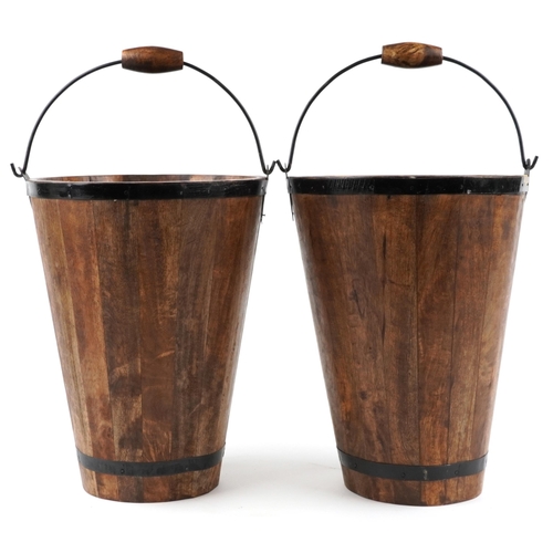 1029 - A pair of Bollinger Champagne hardwood ice buckets with metal mounts and swing handles, H-40cm.