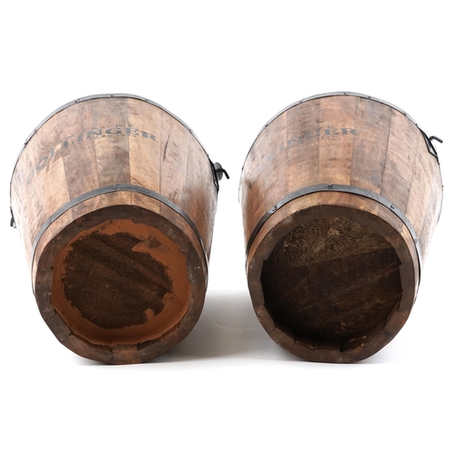 1029 - A pair of Bollinger Champagne hardwood ice buckets with metal mounts and swing handles, H-40cm.