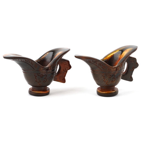 400 - A pair of Chinese carved horn libation cups, 20th century, with incised decoration, H-6cm x W-9cm.