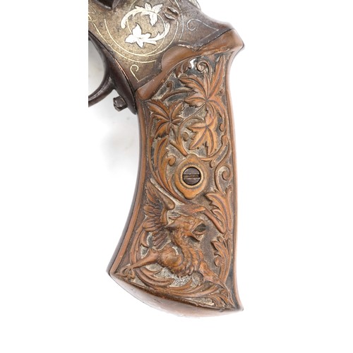 2550 - A 19th century silver inlaid pinfire officer's revolver with octagonal barrel, 27cm in length.