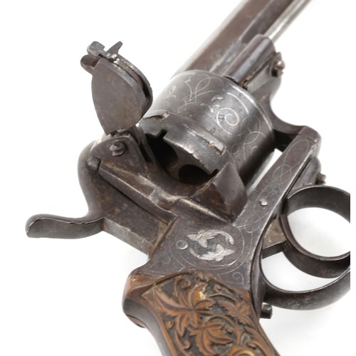 2550 - A 19th century silver inlaid pinfire officer's revolver with octagonal barrel, 27cm in length.