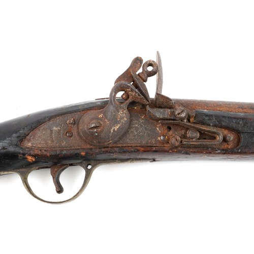 2552 - A 19th century Tower British military flintlock rifle with brass mounts, impressed proof marks, 144c... 