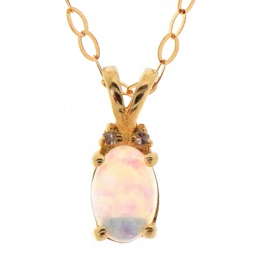 3064 - A 10ct gold cabochon opal and diamond pendant on a 9ct gold necklace, 11mm high and 44cm in length, ... 