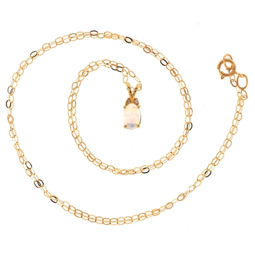 3064 - A 10ct gold cabochon opal and diamond pendant on a 9ct gold necklace, 11mm high and 44cm in length, ... 