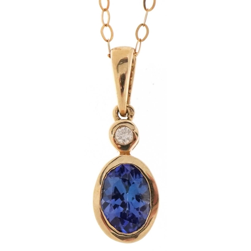 3083 - An unmarked gold tanzanite and diamond pendant on a 9ct gold necklace, 2cm high and 44cm in length, ... 