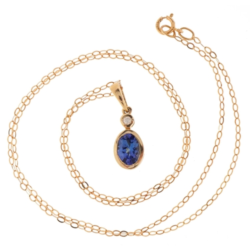 3083 - An unmarked gold tanzanite and diamond pendant on a 9ct gold necklace, 2cm high and 44cm in length, ... 