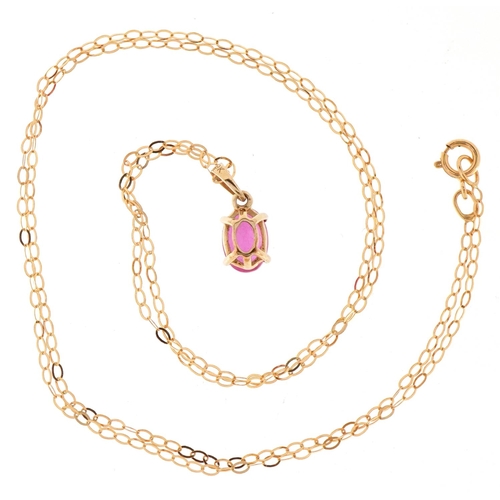 3114 - A 9ct gold pink sapphire solitaire pendant on a 9ct gold necklace, 13mm high and 44cm in length, tot... 