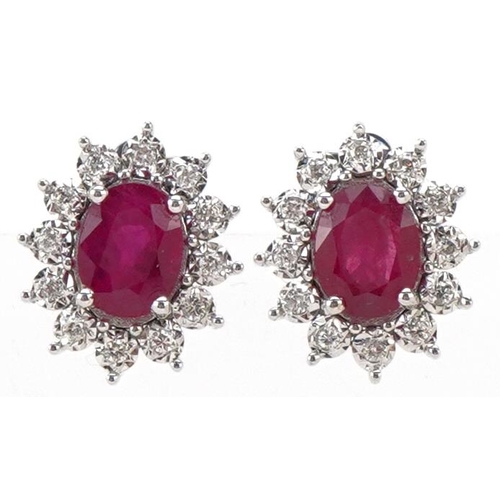 3126 - A pair of 18ct white gold and ruby stud earrings, total ruby weight approximately 2.27 carat, total ... 