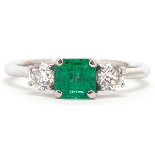 3408 - An 18ct white gold emerald and diamond trilogy ring, the emerald weight approximately 0.66 carat, to... 