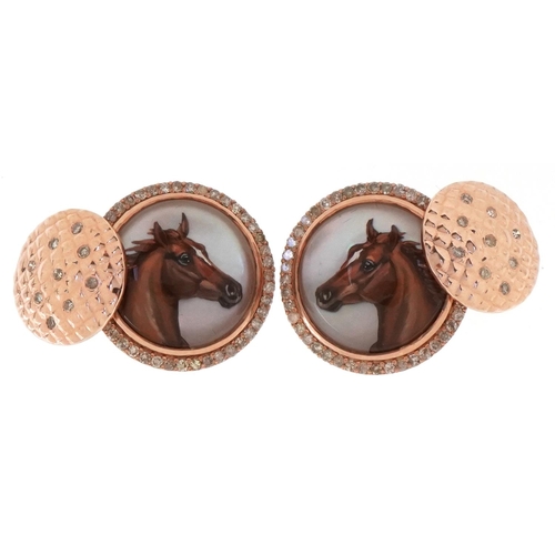 3162 - A pair of 14ct rose gold and diamond Essex crystal design cufflinks decorated with horse heads, each... 