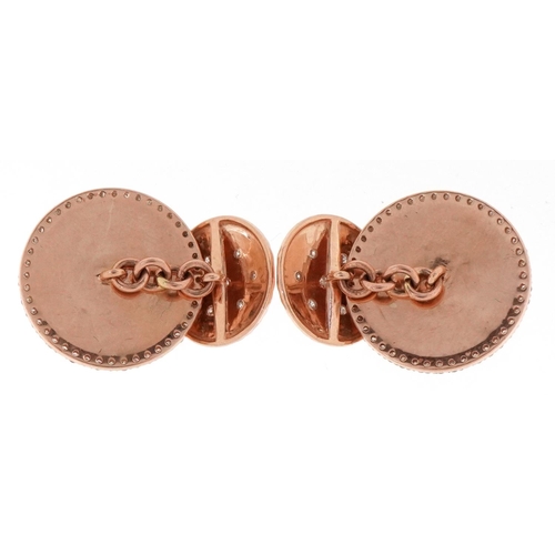 3162 - A pair of 14ct rose gold and diamond Essex crystal design cufflinks decorated with horse heads, each... 