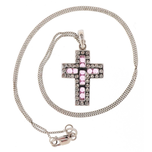 3173 - An 18ct white gold and sapphire cross pendant on an 18ct white gold chain, total sapphire weight app... 