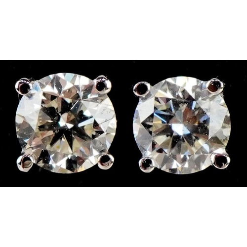 3227 - A pair of 18ct white gold diamond solitaire stud earrings, total diamond weight approximately 0.40 c... 