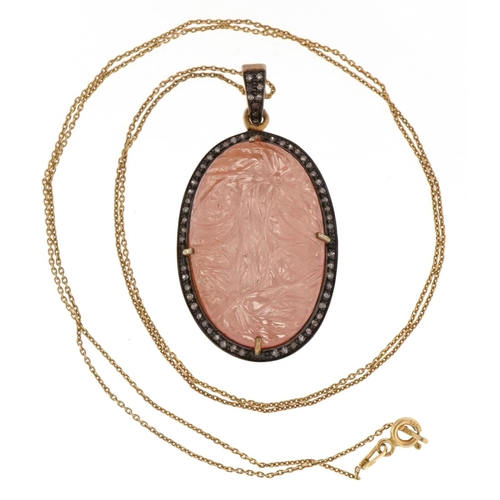 3051 - A large silver gilt rose quartz and diamond pendant on a gold plated silver chain, 4cm high x 2.8cm ... 