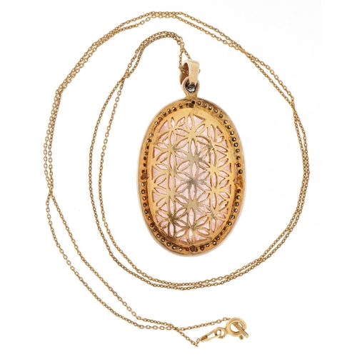 3051 - A large silver gilt rose quartz and diamond pendant on a gold plated silver chain, 4cm high x 2.8cm ... 