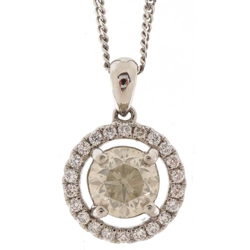 3348 - A platinum and diamond halo pendant on a silver fine link necklace, the central diamond approximatel... 