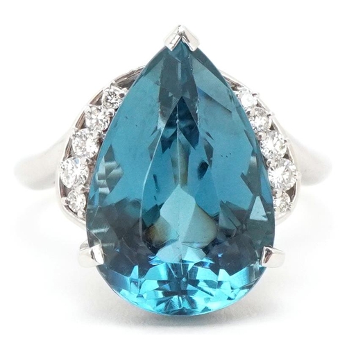 3183 - A heavy platinum topaz and diamond teardrop ring, the topaz approximately 13.72 carat, total diamond... 