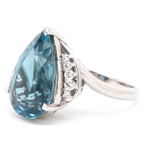 3183 - A heavy platinum topaz and diamond teardrop ring, the topaz approximately 13.72 carat, total diamond... 