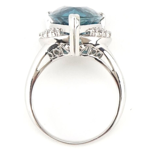 3183 - A heavy platinum topaz and diamond teardrop ring, the topaz approximately 13.72 carat, total diamond... 