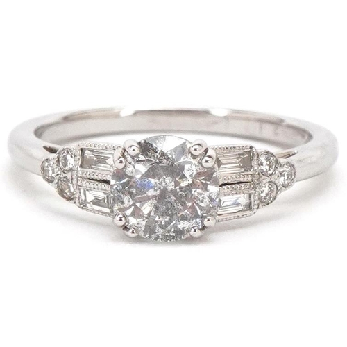 3004 - An 18ct white gold diamond solitaire ring with diamond set shoulders, the solitaire diamond approxim... 