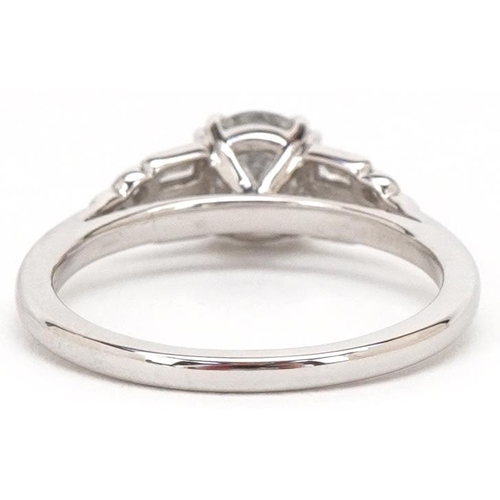 3004 - An 18ct white gold diamond solitaire ring with diamond set shoulders, the solitaire diamond approxim... 