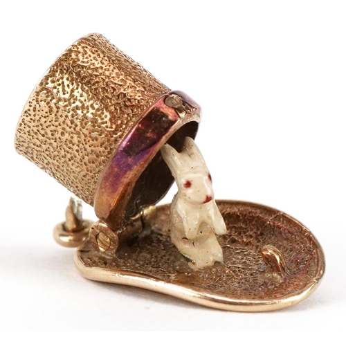 3068 - A 9ct gold charm in the form of a magician's hat opening to reveal an enamelled bunny, 20mm in lengt... 