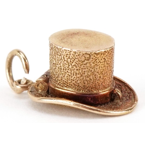 3068 - A 9ct gold charm in the form of a magician's hat opening to reveal an enamelled bunny, 20mm in lengt... 