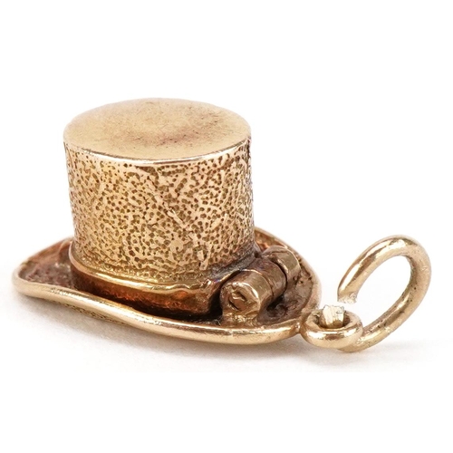 3068 - A 9ct gold charm in the form of a magician's hat opening to reveal an enamelled bunny, 20mm in lengt... 