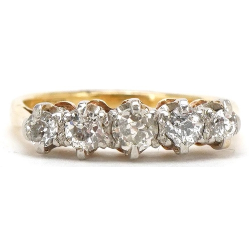 3043 - An 18ct gold graduated diamond five stone ring, the central diamond approximately 0.15 carat, size I... 