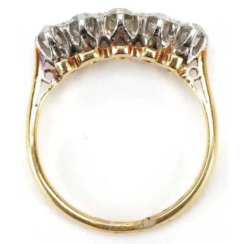 3043 - An 18ct gold graduated diamond five stone ring, the central diamond approximately 0.15 carat, size I... 