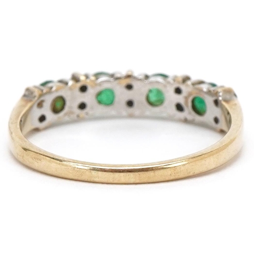 3383 - A 9ct gold emerald and diamond half eternity ring, size Q, 2.0g.