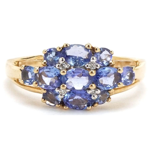 3205 - A 9ct gold iolite and diamond cluster ring, size M, 2.4g.