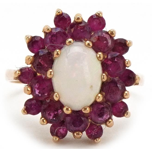 3413 - An unmarked gold cabochon opal and pink spinel three tier cluster ring, size M, 3.4g.