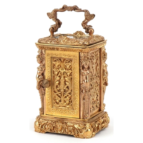 234 - A miniature gilt brass Rococo style carriage clock, the enamelled dial with Roman numerals and swing... 