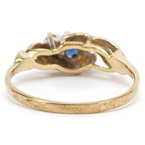 3216 - A 9ct gold sapphire and diamond three stone crossover ring, size K/L, 1.7g.