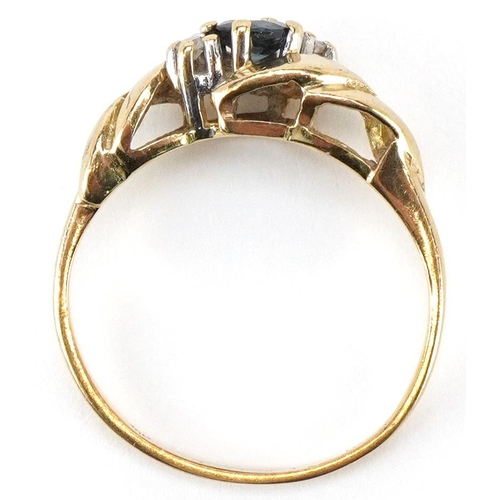 3216 - A 9ct gold sapphire and diamond three stone crossover ring, size K/L, 1.7g.