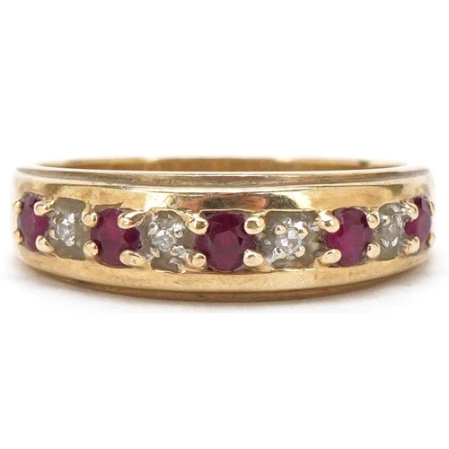 3500 - A 9ct gold ruby and diamond half eternity ring, size L/M, 2.3g.