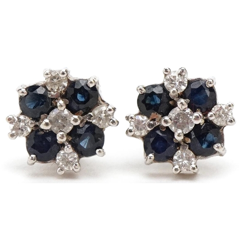 3209 - A pair of 9ct white gold diamond and sapphire cluster stud earrings, overall 10mm in diameter, total... 