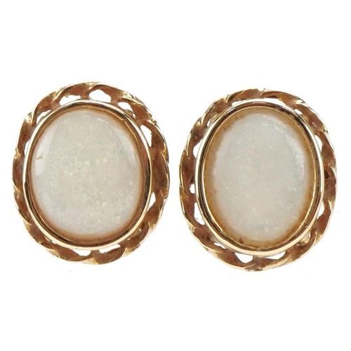 3499 - A pair of 9ct gold cabochon opal stud earrings, 12.5mm high, total 2.1g.