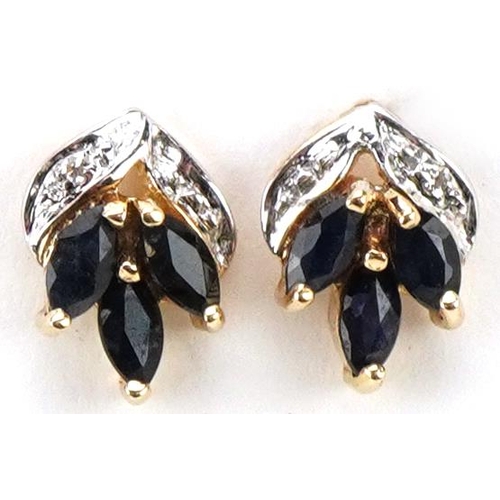 3233 - A pair of unmarked gold sapphire and diamond floral stud earrings, 9.5mm high, total 1.1g.