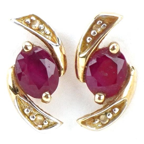 3464 - A pair of 9ct gold ruby and diamond stud earrings, 12.0mm high, total 1.0g.