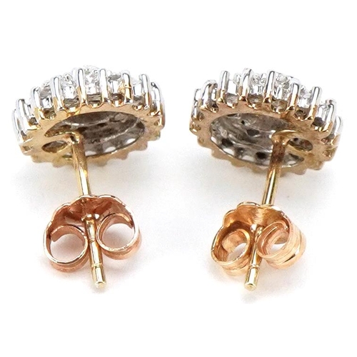 3059 - A pair of unmarked gold diamond four tier cluster stud earrings, 9.0mm in diameter, total 1.7g.