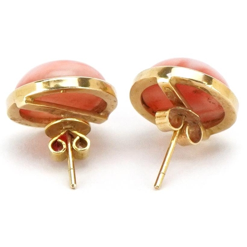 3342 - A pair of 18ct gold coral stud earrings, 13.2mm in diameter, total 5.7g.