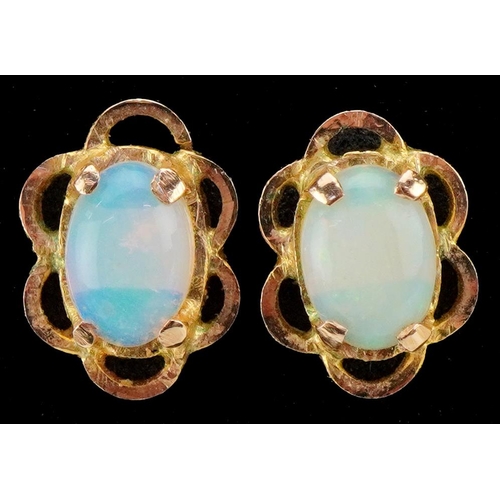 3482 - A pair of yellow metal cabochon opal stud earrings, 9.8mm high, total 2.1g.