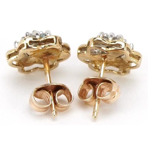 3198 - A pair of unmarked gold diamond flower head stud earrings, 9.2mm in diameter, total 1.8g.