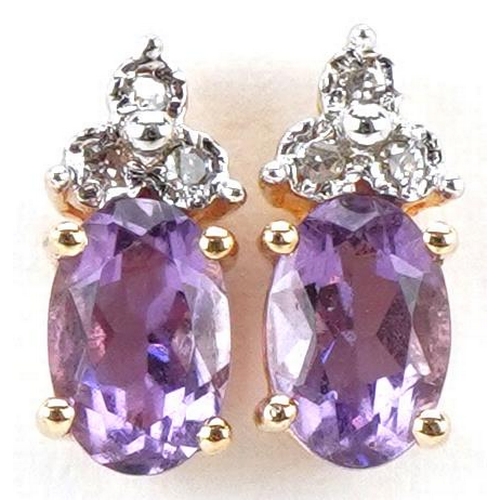 3204 - A pair of 9ct gold amethyst and diamond stud earrings, 9.6mm high, total 1.1g.